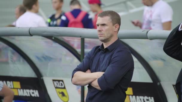 Football coach Sergiy Rebrov in the stadium during a football match. — ストック動画