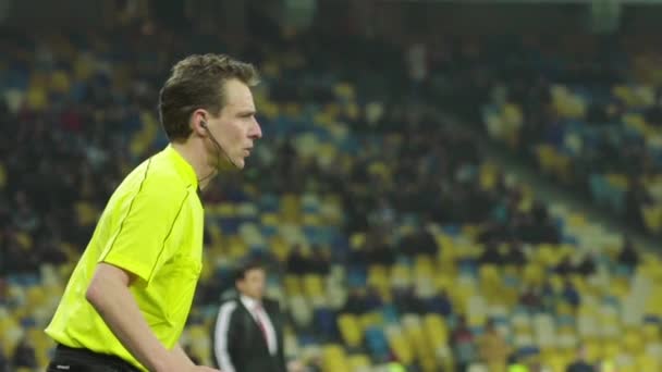 Male referee during a football soccer match. Slow motion — ストック動画