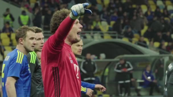 Goalkeeper Andriy Pyatov during a football match. Slow motion. Olimpiyskiy. Kyiv. Ukraine. — Stock Video