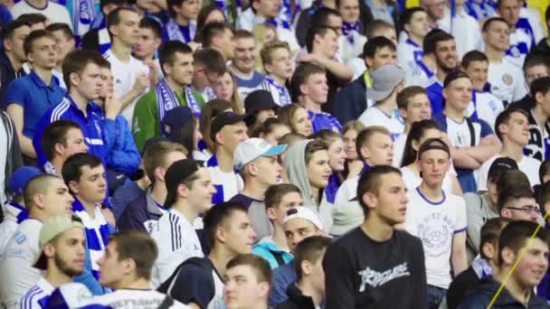 Fans at the stadium during the match. Slow motion. Olimpiyskiy. Kyiv. Ukraine. — ストック動画