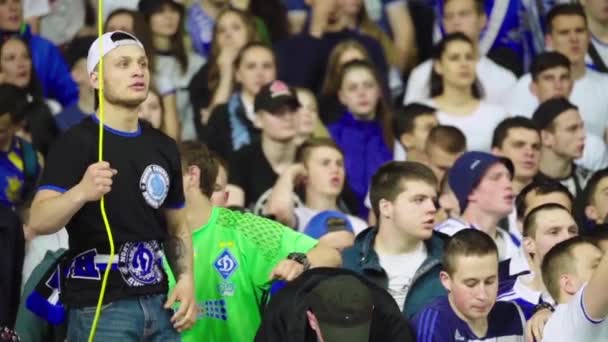 Fans at the stadium during the match. Slow motion. Olimpiyskiy. Kyiv. Ukraine. — ストック動画