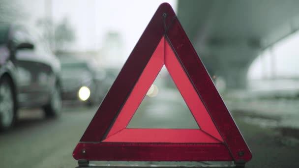 Warning sign "Red Triangle" on the road. Close-up. Crash. Car breakdown — Stock Video