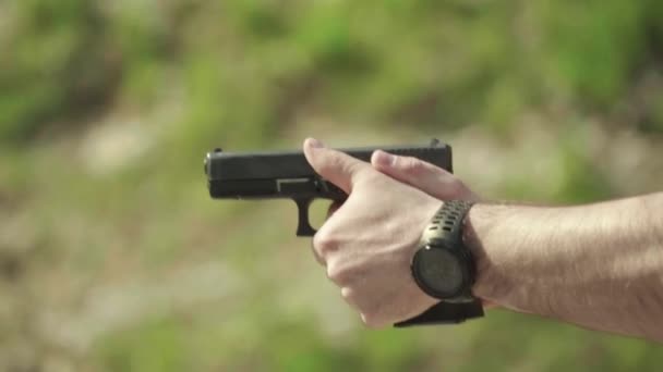 Close-up shot of a pistol. Slow motion. — Stock Video