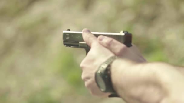 Close-up shot of a pistol. Slow motion. — Stock Video