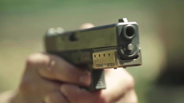 Close-up shot of a pistol. Slow motion. — Stock Video