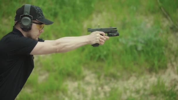 Pistol shooting. Slow motion. Close-up. — Stock Video