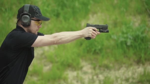 Pistol shooting. Slow motion. Close-up. — Stock Video