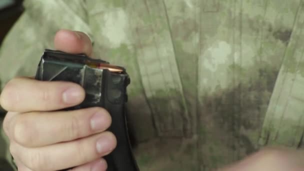 Cartridges charge bullet. Close-up. Shooting — Stockvideo