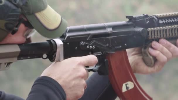 Shooter with a rifle while shooting — Stock Video