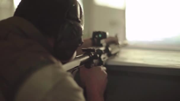 Shooter with a rifle while shooting — Stock Video