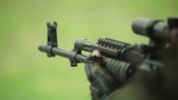 Rifle in the hands of a shooter during shooting. Slow motion. Close-up. — Stock Video