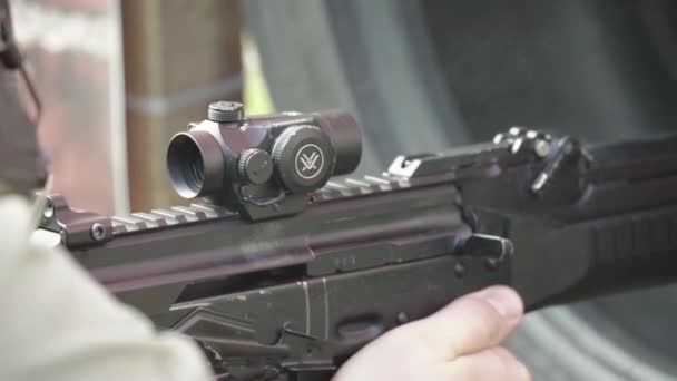 Rifle in the hands of a shooter during shooting. Slow motion. Close-up. — Stock Video