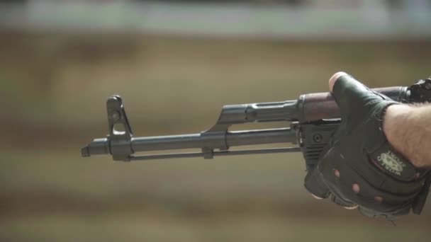 Rifle in the hands of a shooter during shooting. Slow motion. Close-up. — Stock Video