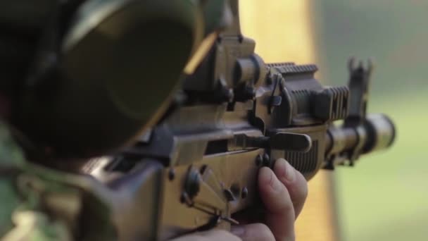 Rifle in the hands of a shooter during shooting. Slow motion. Close-up. — Stock Video