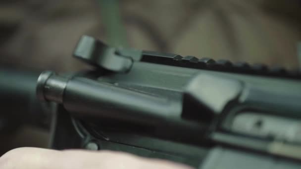 Rifle in the hands of a shooter during shooting. Slow motion. Close-up. — Stock Video