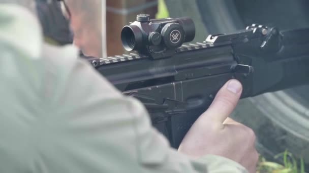 Rifle in the hands of a shooter during shooting. Slow motion. Close-up. — Stock Video