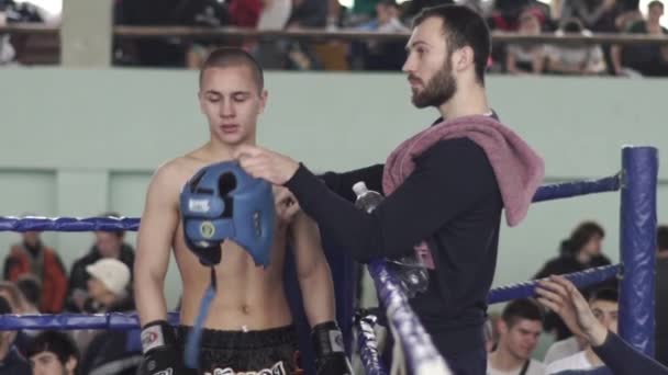 Kickboxing. Young fighter in the corner of the ring. Slow motion. Kyiv. Ukraine — Stock Video