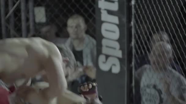 Fight in the MMA octagon. Slow motion. Kyiv. Ukraine — Stock Video