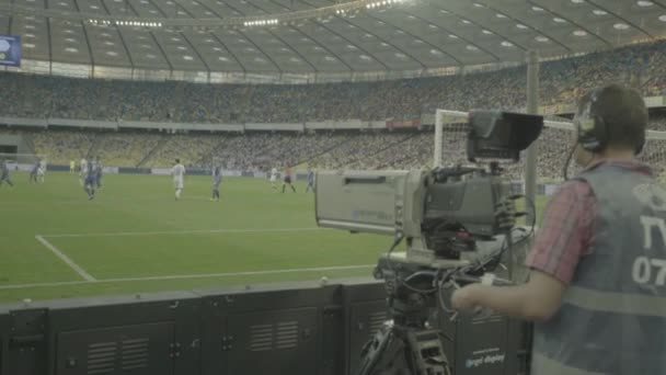 Cameraman with a camera in the stadium during a football TV
