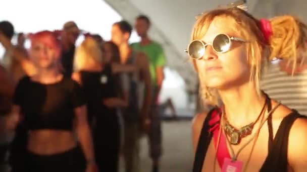 The girl is dancing on the dance floor in a disco. Festival. Joy. — Stock Video