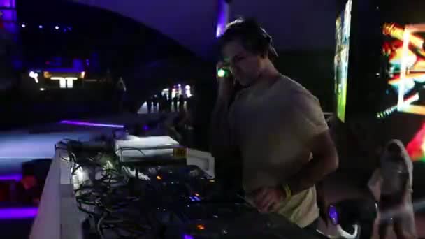 DJ plays music at the party. Disco. Festival. Joy. — Stock Video