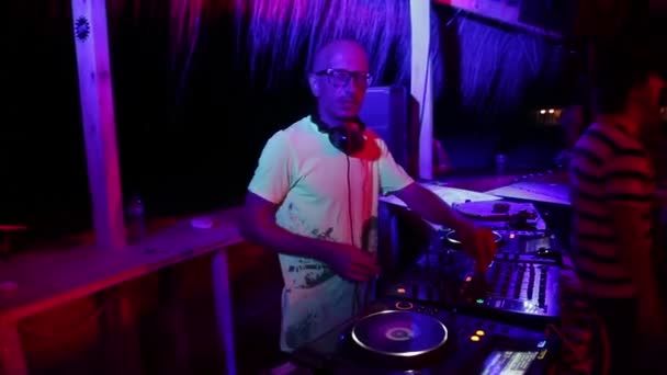 DJ plays music at the party. Disco. Festival. Joy. — Stock Video