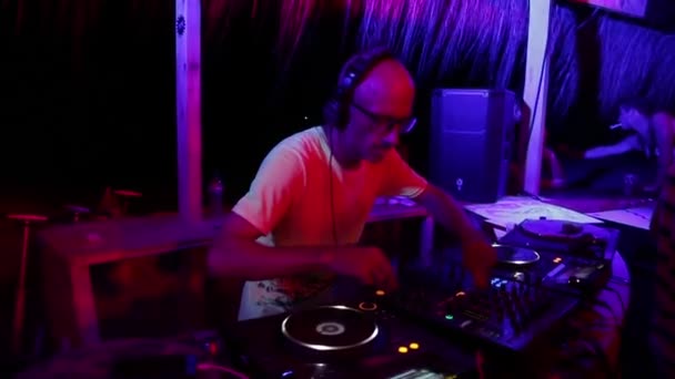 DJ plays music at the party. Disco. Festival. Joy. — Stock Video