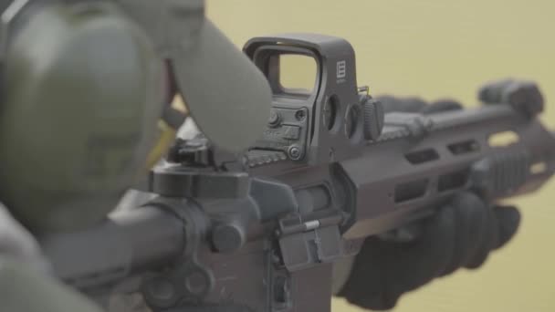 Rifle in the hands of a shooter during shooting. Slow motion. Close-up. — Stock Video