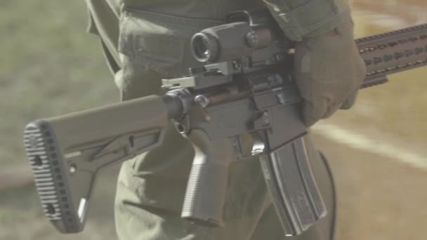 Rifle in the hands of a shooter during shooting. Slow motion. Close-up. — Stock Video