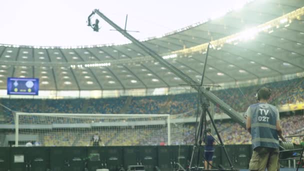 Cameraman with a camera in the stadium during a football match