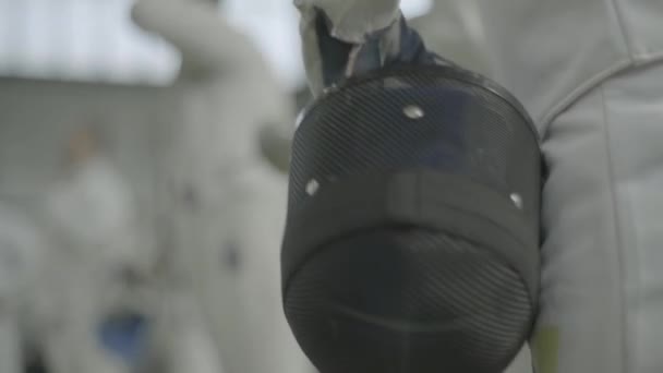 Fencing helmet. Close-up. Slow motion — Stock video