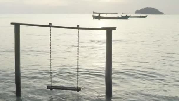 Empty swing in the sea. Sihanoukville. Cambodia. Asia — Stock Video