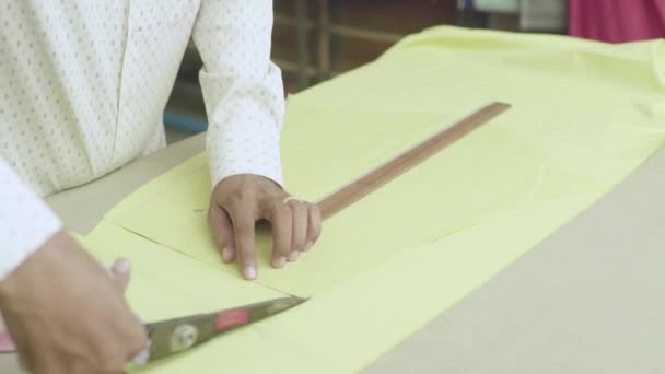 A male tailor works with a cloth. Phnom Penh, Cambodia, Asia — Stock Video