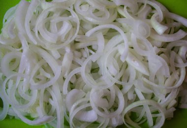 Sliced white onion rings. culinary background. copy space, top view, flat lay, background with blank space for text