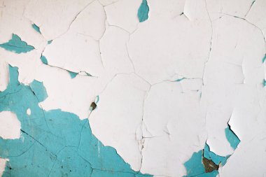 Duvarın dokusu ve soyulmuş boya. Turkuaz ve beyaz boya..