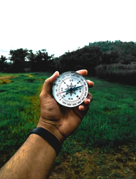 HOLDING COMPASS IN HAND — Stock Photo, Image