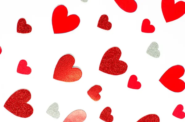 Valentine's day concept. Background from different bright red hearts on a white background — Stock Photo, Image