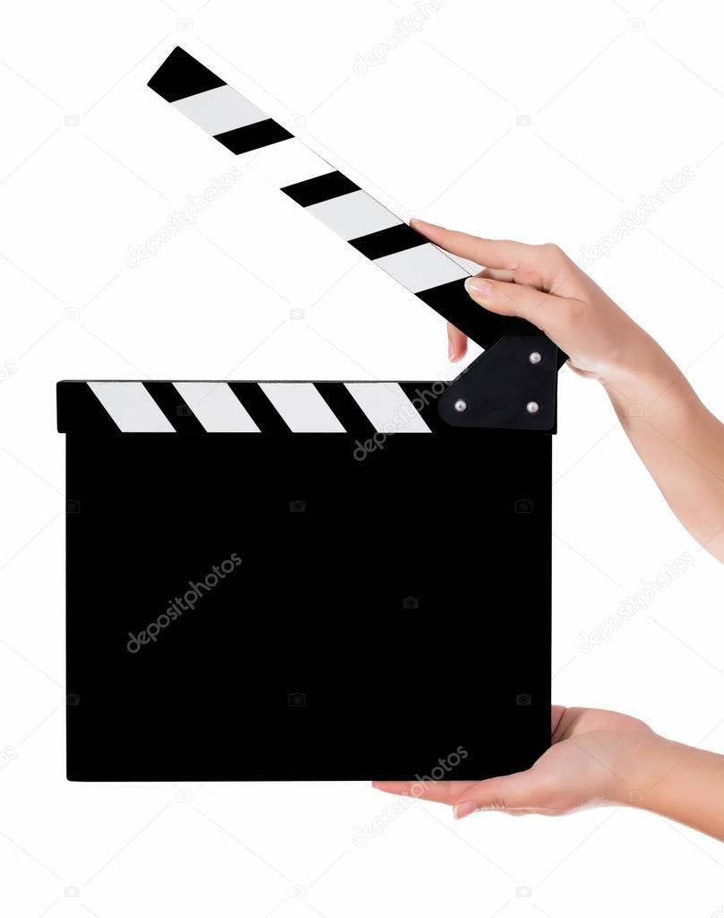 Hands holding a clapper board 