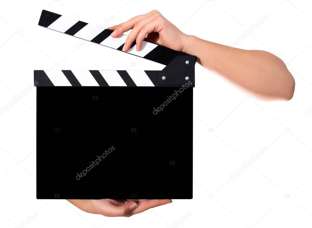 Hands holding a clapper board 