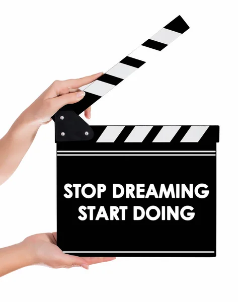 Hands holding a clapper board with STOP DREAMING START DOING tex — Stock Photo, Image