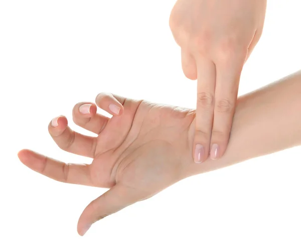 Vrouwelijke hand controleren puls op witte achtergrond. — Stockfoto