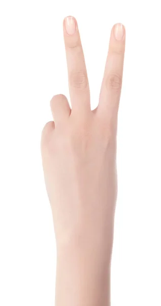 Handen visar tecknet för seger och fred. Närbild av kvinnliga h — Stockfoto