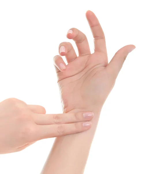 Pulso de la mano femenina sobre fondo blanco . — Foto de Stock