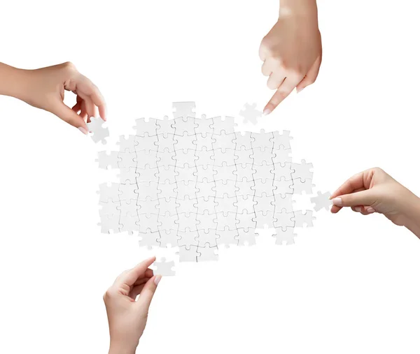 Hand holding a piece of white uncompleted puzzle — Stock Photo, Image