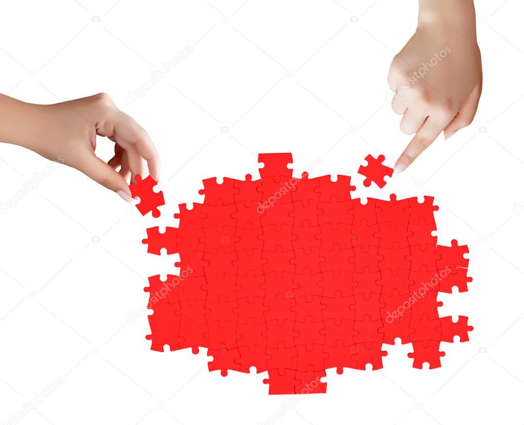 hand holding a piece of red uncompleted puzzle