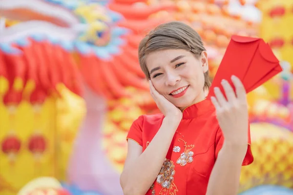 Asian women wearing red dresses, Chinese New Year.
