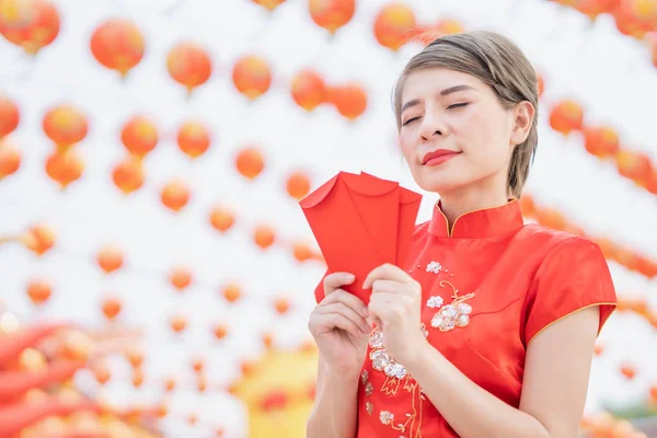 Asian women wearing red dresses, Chinese New Year.