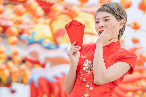 Asian women wearing red dresses, Chinese New Year.