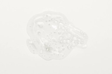 Serum dokusu. Beyaz arka planda izole edilmiş kabarcıklar swatch ile temiz sıvı jel