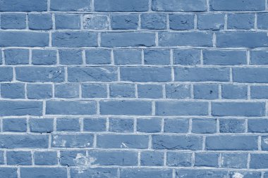 Çatlak ve desenli mavi duvar, tuğla duvar arka planı. 2020 yılının rengi konsepti. Kapatın. New York moda haftasından 2020 bahar-yaz sezonunun klasik mavi rengi